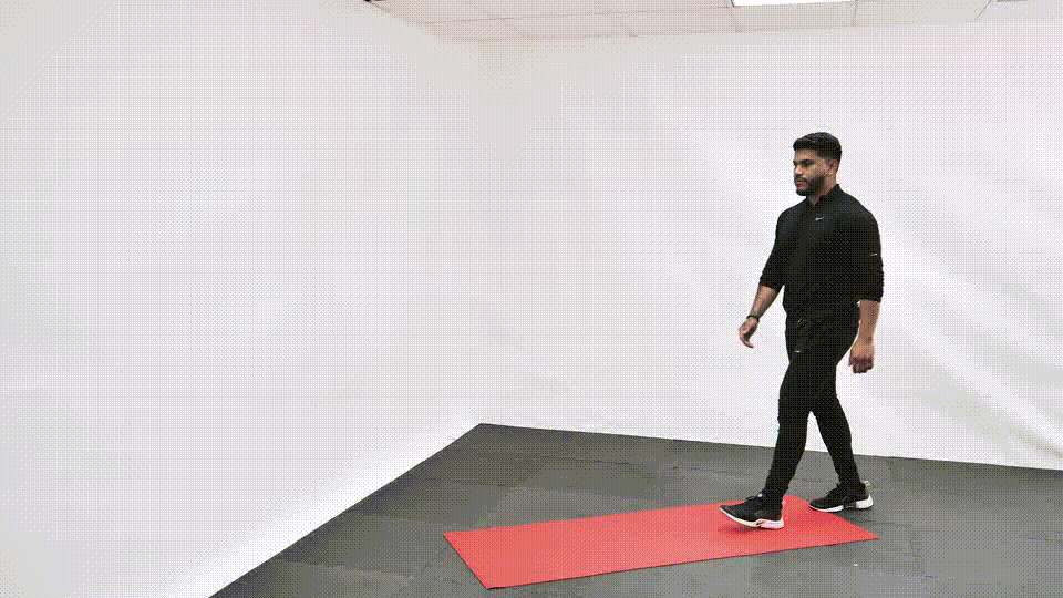 Standing quad stretch demonstration